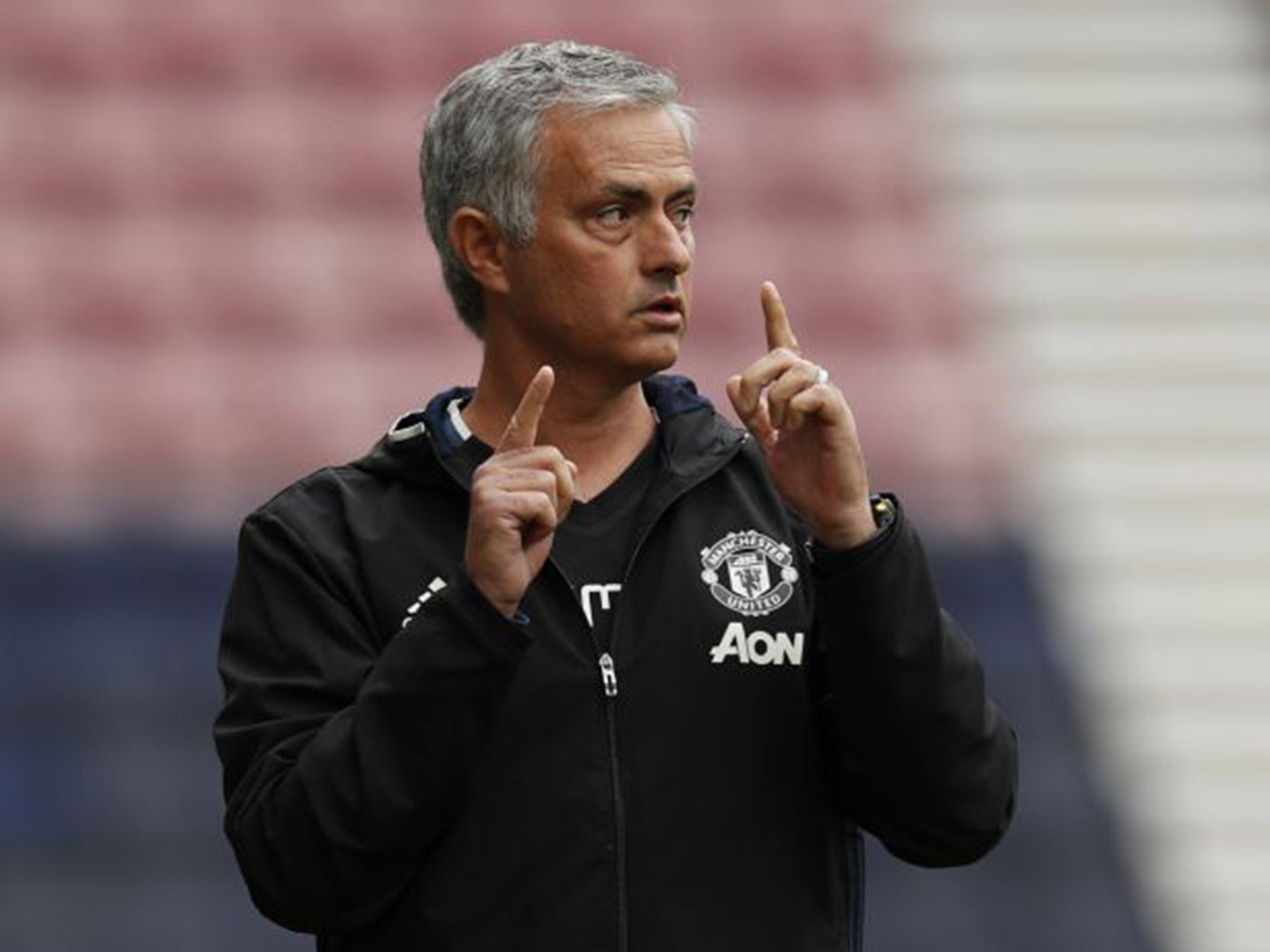 Jose Mourinho gives out instructions during Manchester United's pre-season friendly against Wigan