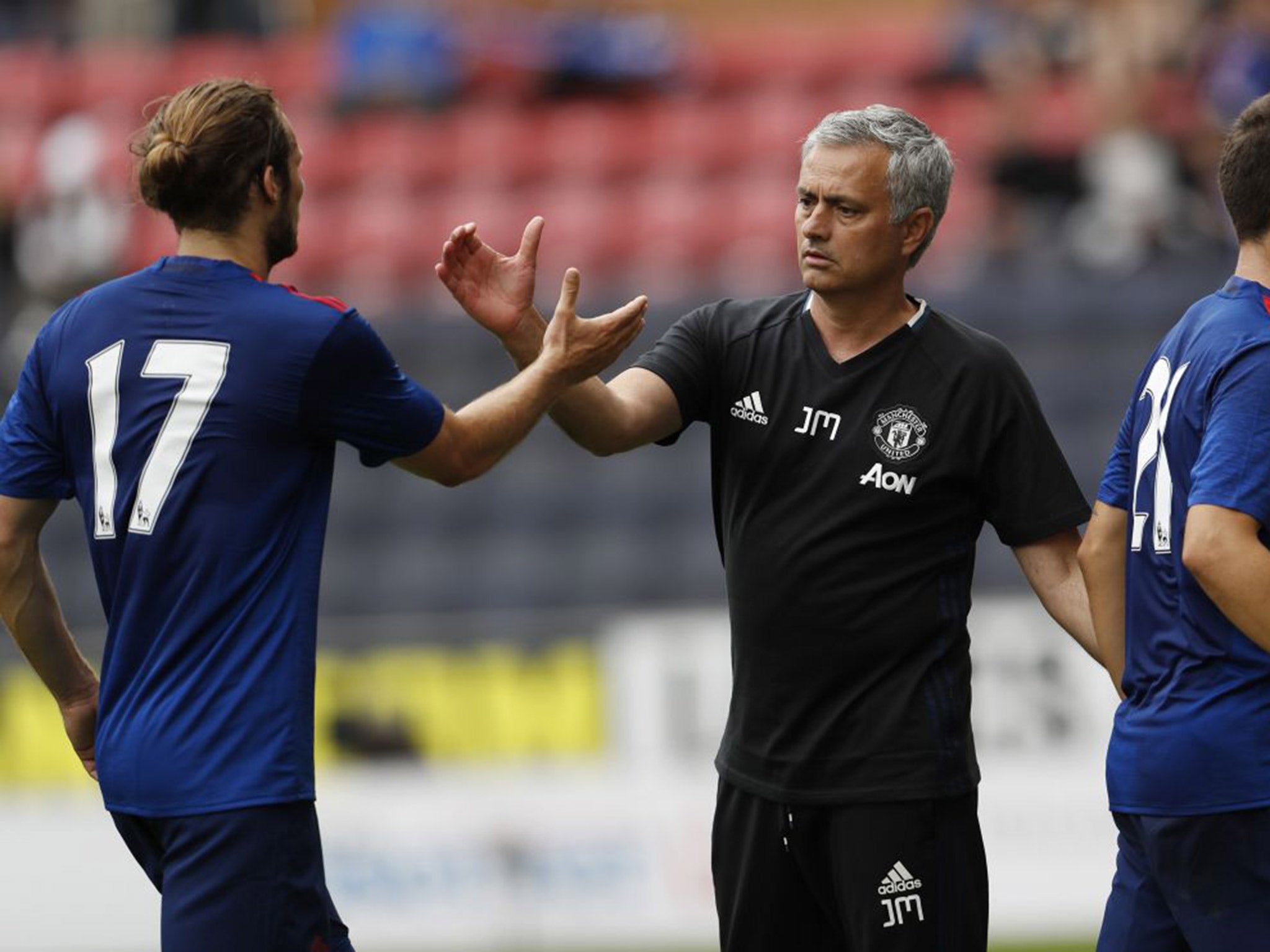 Jose Mourinho shakes hands with Daley Blind after the 2-0 win over Wigan