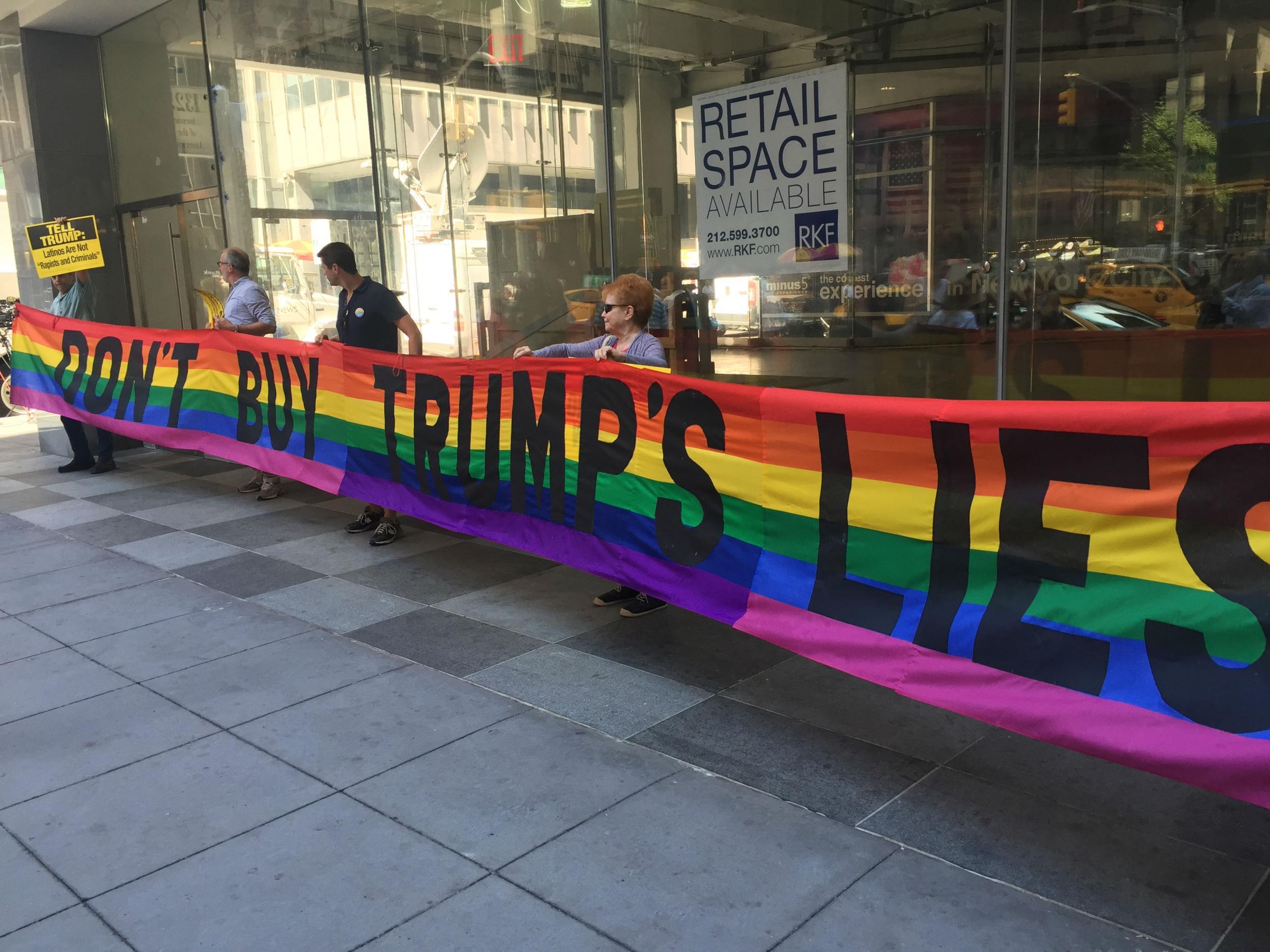 Protesters challenging Trump's record on gay rights outside the Manhattan hotel