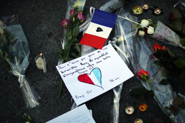 A tribute is laid on the ground where a person was killed on the Promenade des Anglais, Nice