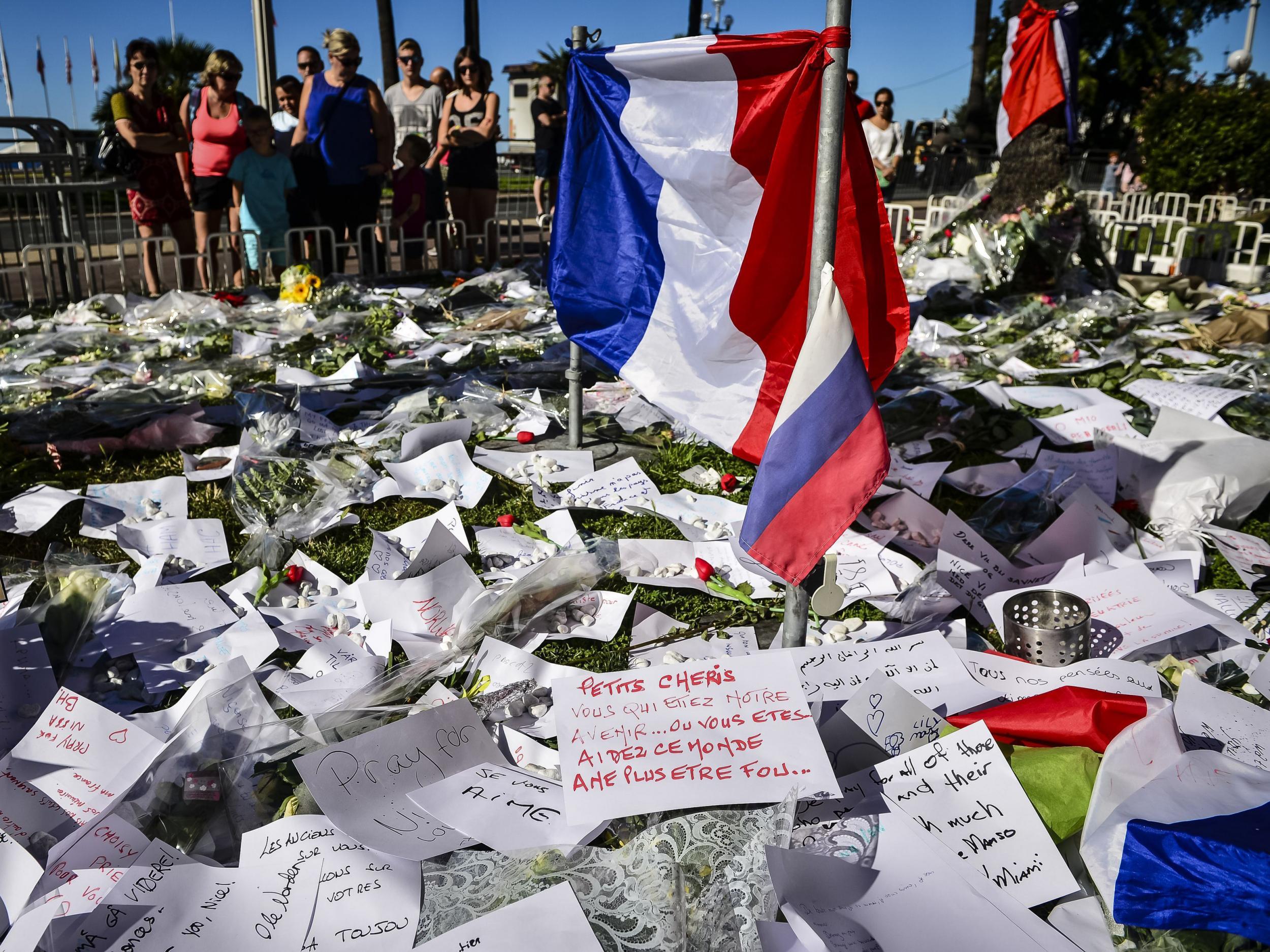 Hundreds of handwritten tributes are laid on the Promenade des Anglais
