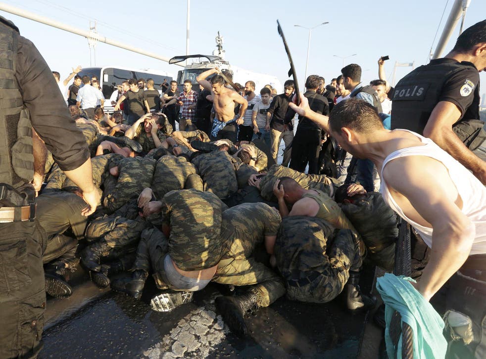 <p>Civilians in Istanbul beat surrendered soldiers involved in the attempted coup in July 2016</p>