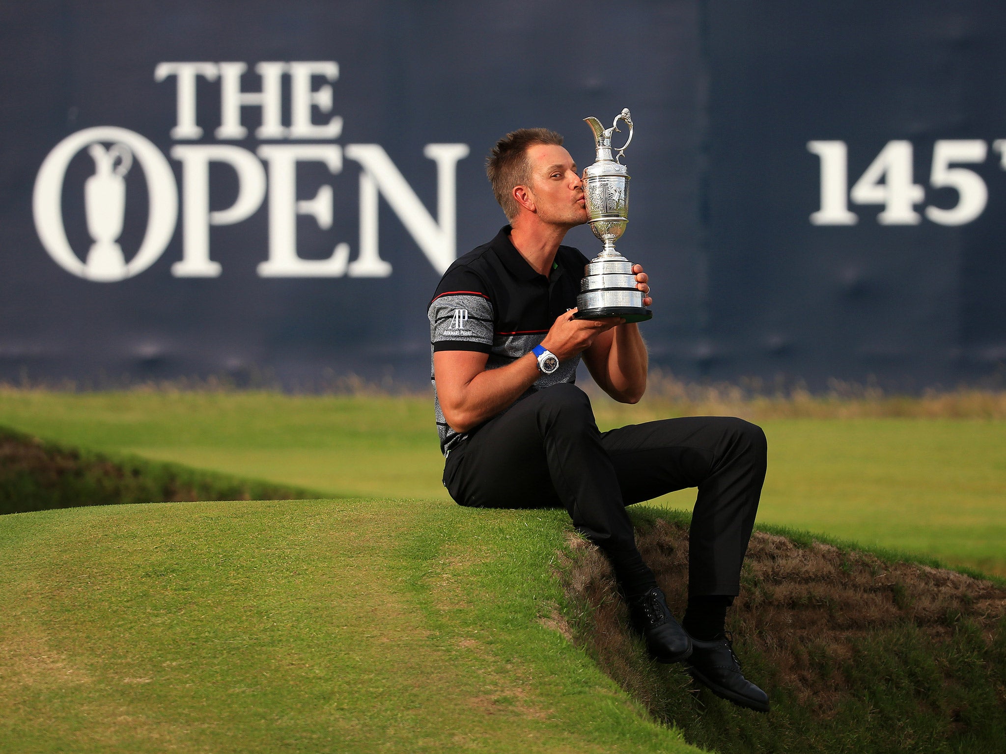 Henrik Stenson celebrates with the Claret Jug after winning The Open at Royal Troon
