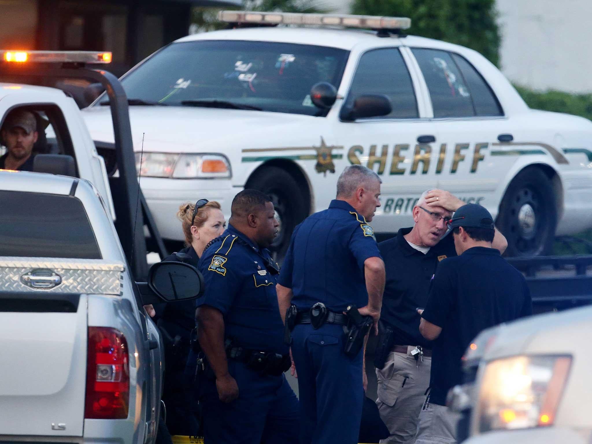 An East Baton Rouge police car with bullet holes as it's towed away from the scene