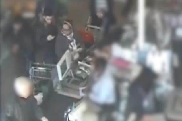 CCTV shows thieves distract elderly woman before stealing her bank card