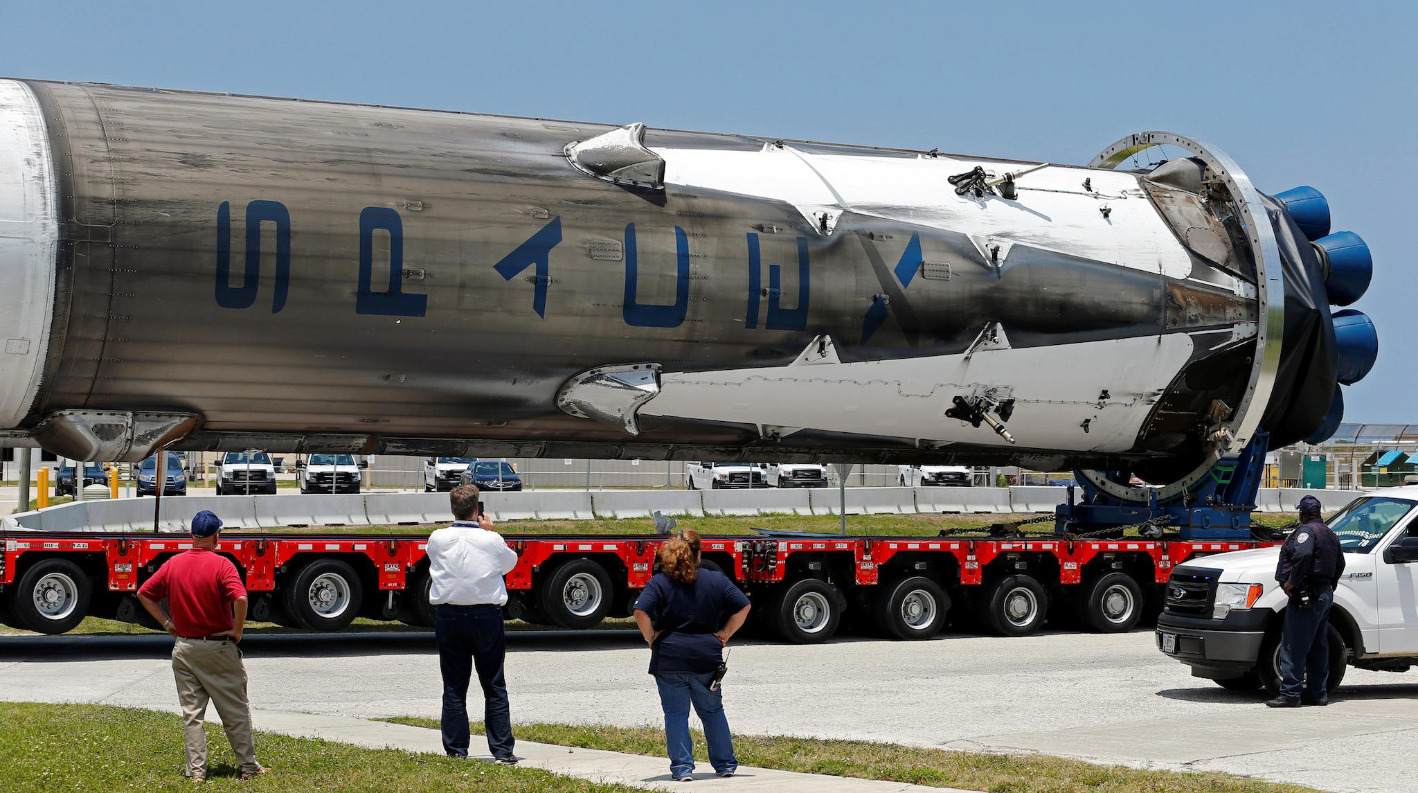 The recovered first stage of a SpaceX Falcon 9 rocket is transported to the SpaceX hangar at launch pad 39A at the Kennedy Space Center in Cape Canaveral, Florida May 14, 2016