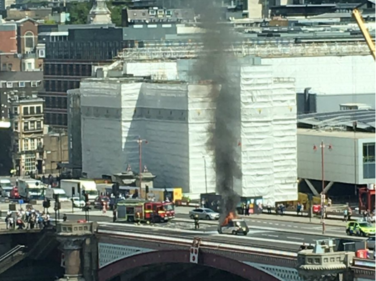 Blackfriars Bridge fire Road closed to traffic as black cab goes