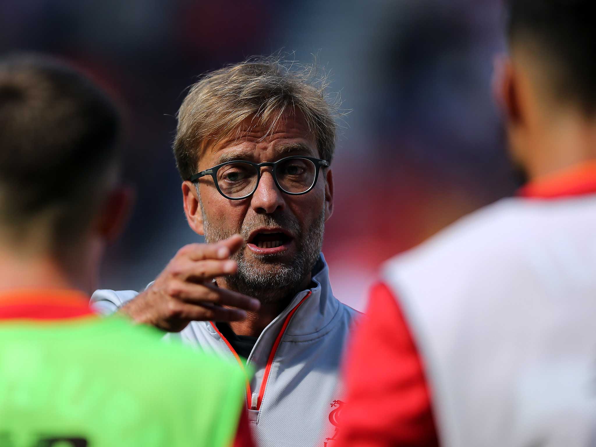 Jurgen Klopp gives his players instructions during Liverpool's victory against Wigan