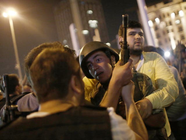 Turkish police arrest Turkish soldiers at Taksim Square in Istanbul on 16 July 2016