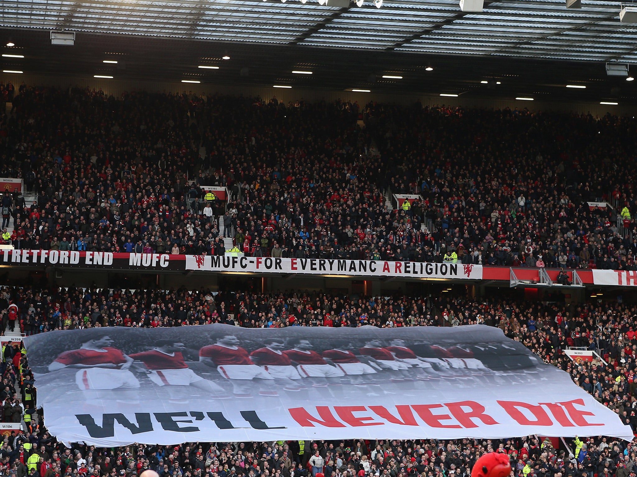 A banner paying tribute to the 'Busby Babes' is displayed in the Stretford End at Old Trafford