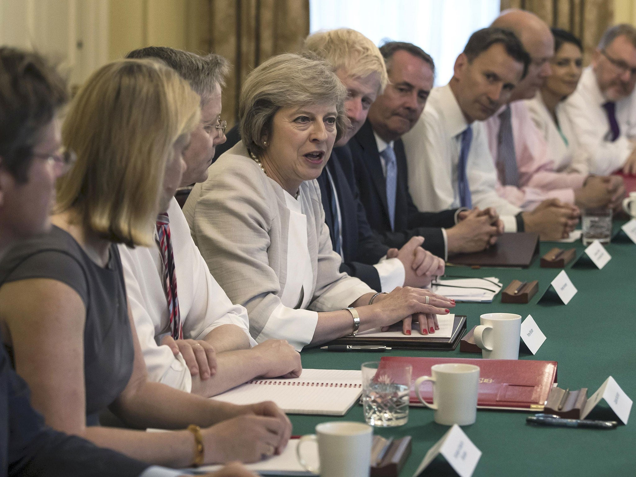 Britain's Prime Minister Theresa May (C) holds her first Cabinet Meeting at Downing Street, in London July 19, 2016