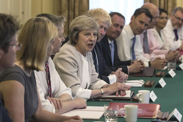 Britain's Prime Minister Theresa May (C) holds her first Cabinet Meeting at Downing Street, in London July 19, 2016