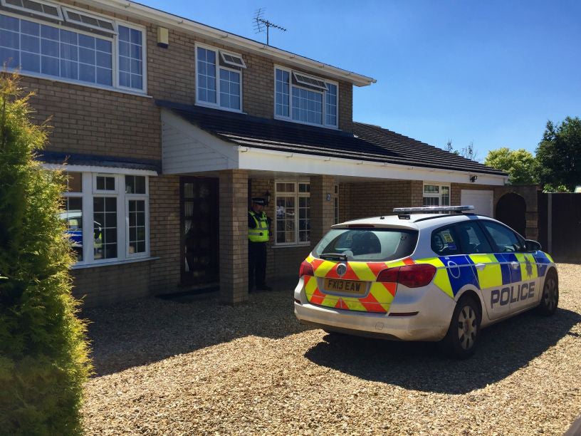 Police outside a property in Hatt Close, Moulton, Spalding, after a man is believed to have shot dead two female members of his family