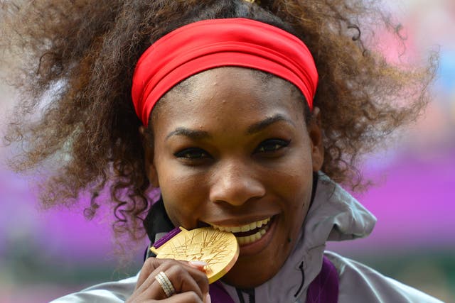 Williams celebrates with her gold medal at London 2012