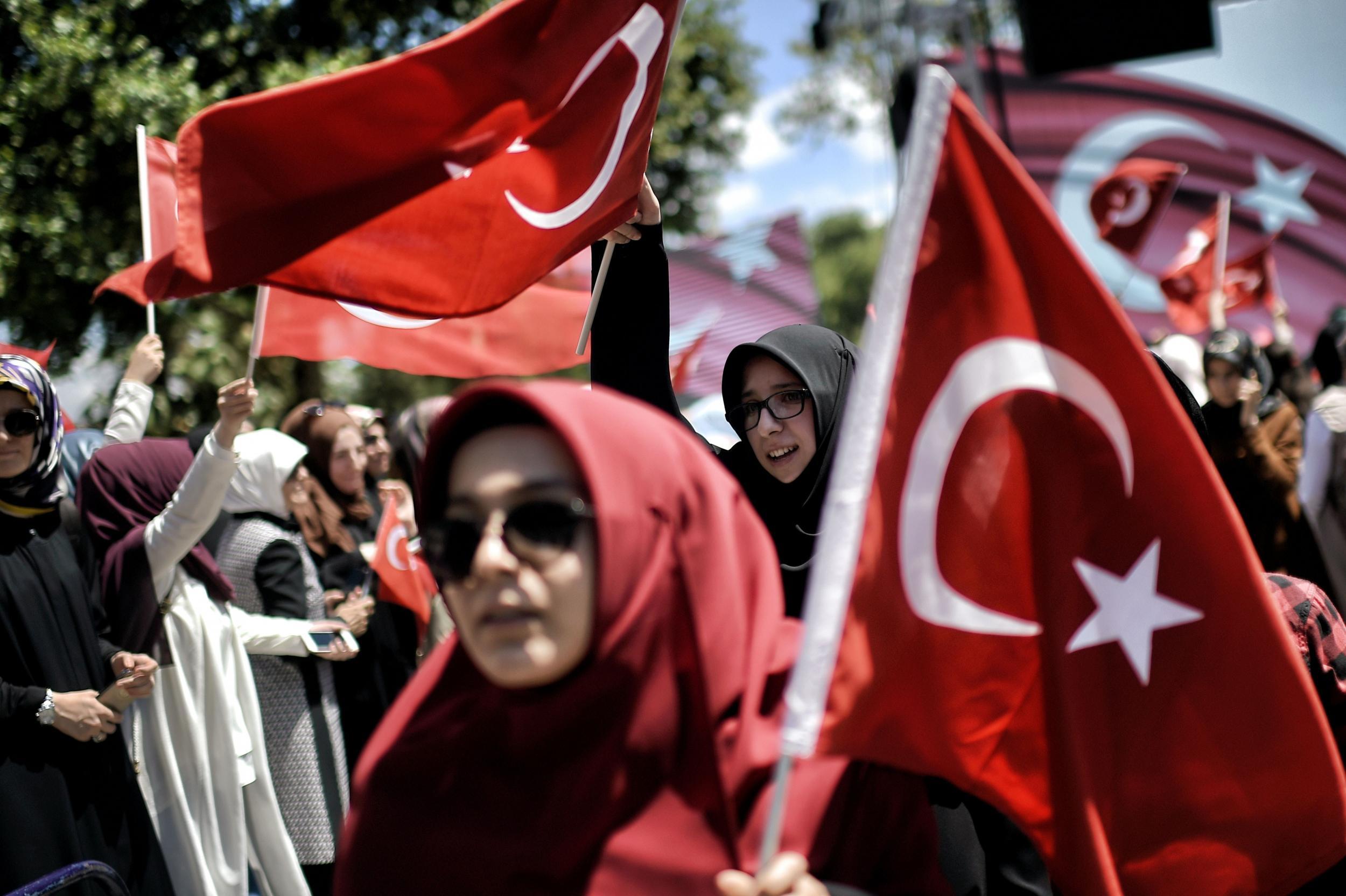 Pro-Erdogan supporters wave Turkish flags during a demonstration in support to Turkish president (AFP/Getty)