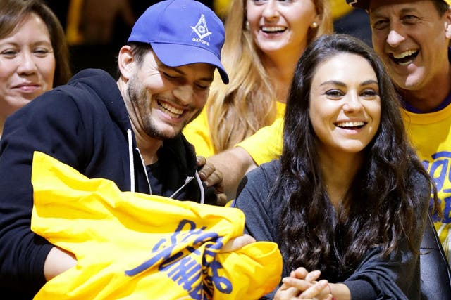 If Kutcher and Kunis are photographed together it's usually when they're sat courtside