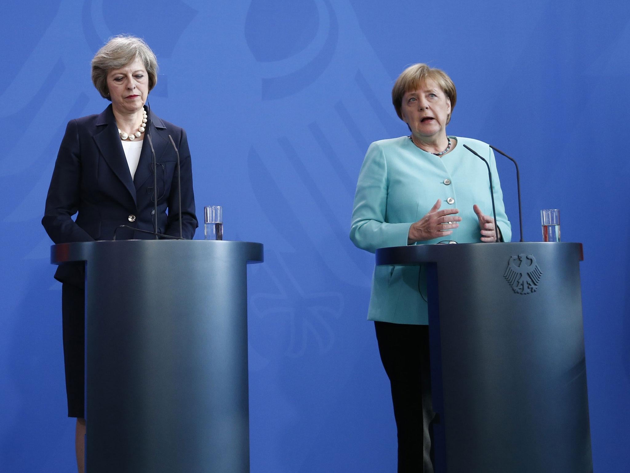 There were few kind words between Theresa May (left) and Anglea Merkel in Berlin