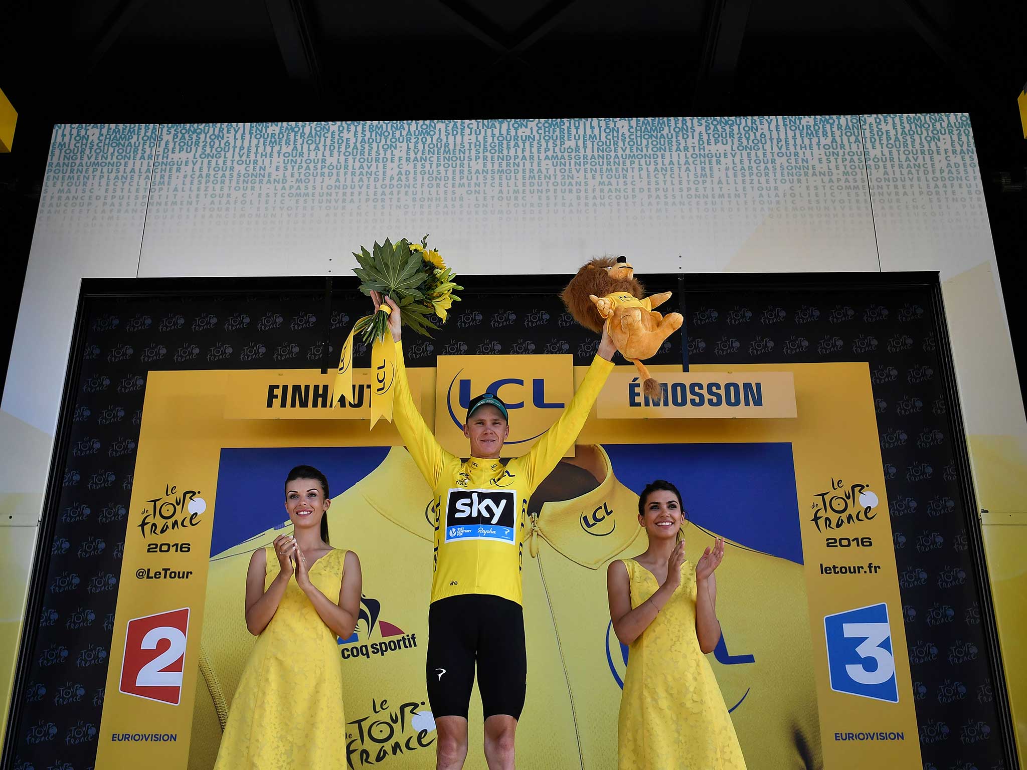 Chris Froome celebrates with the yellow jersey secure