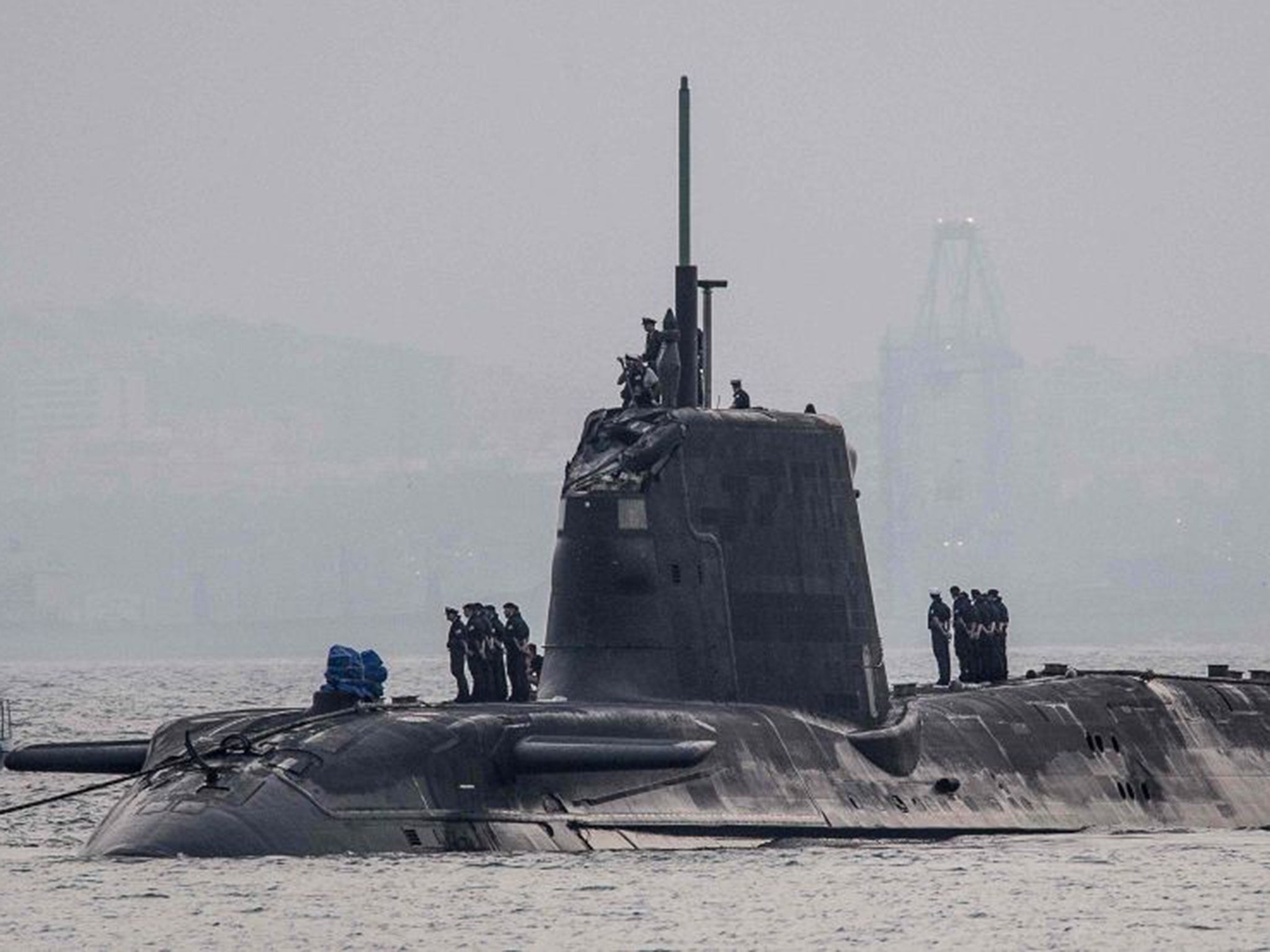 Damage is visible on the conning tower of HMS Ambush, an Astute-class nuclear-powered attack submarine