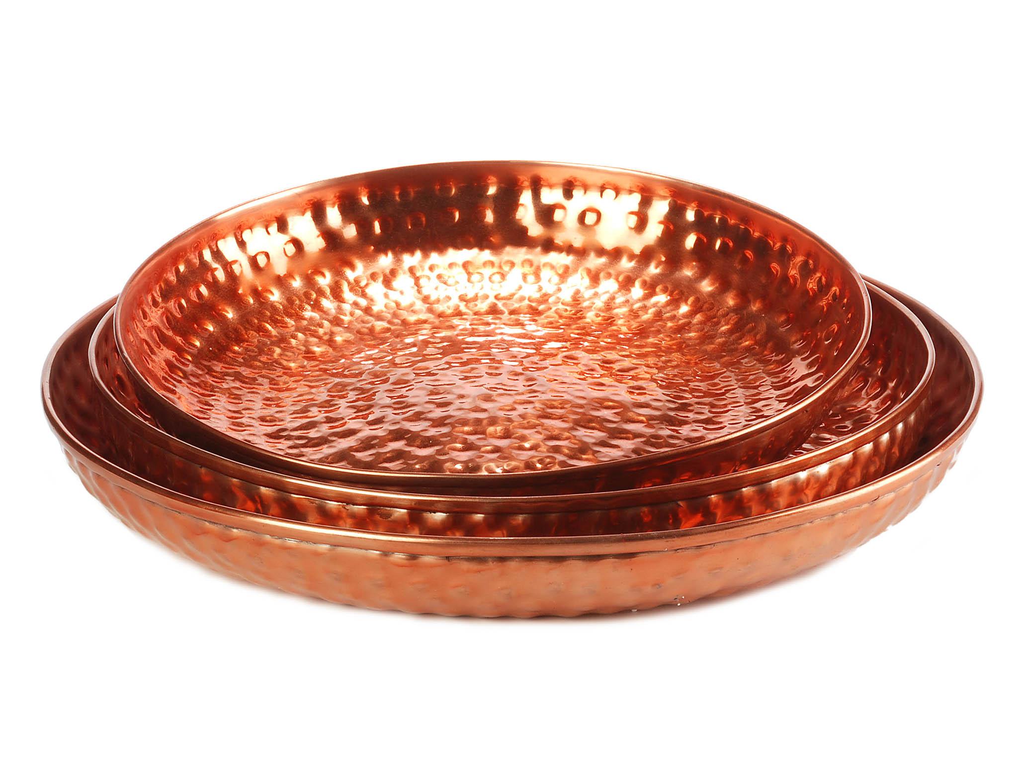 Shiny hammered copper trays – a set of three costs £42.00 (Amara )