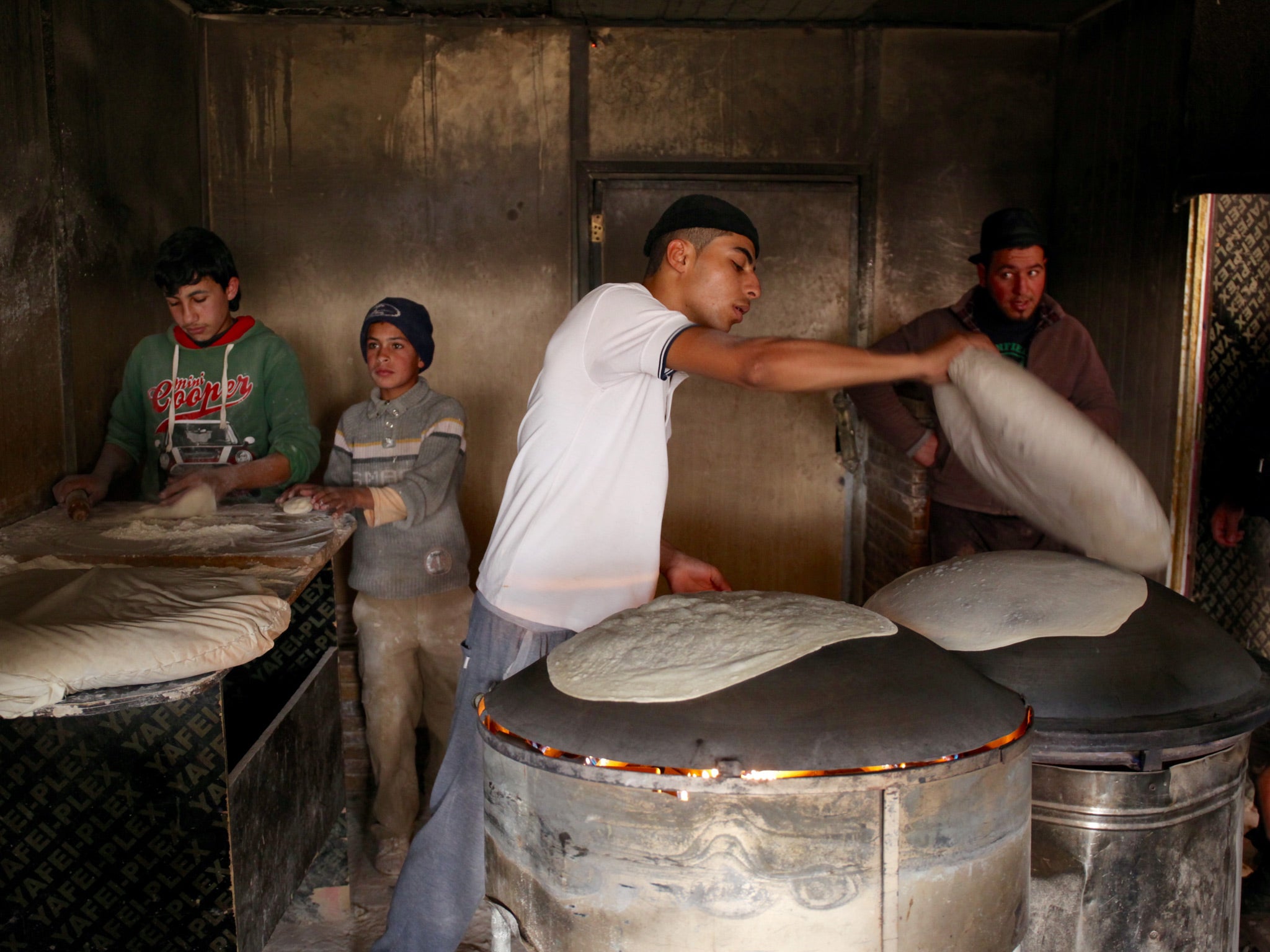 Many children choose to work in Zaatari's businesses to help support their families instead of going to school