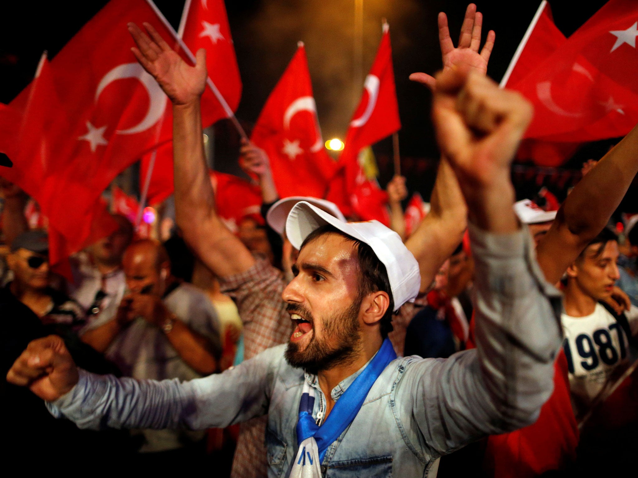 Supporters of President Erdogan in Istanbul's Taksim Square, where thousands of people have gathered in recent days
