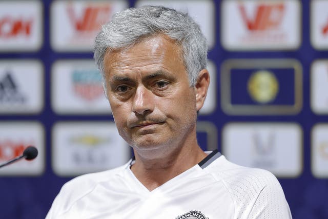 Mourinho answers questions during a press conference in China