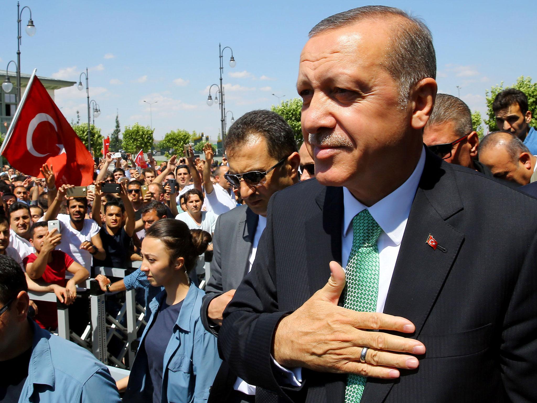 Turkish President Tayyip Erdogan greets his supporters following the Friday prayers in Ankara, Turkey, 22 July, 2016