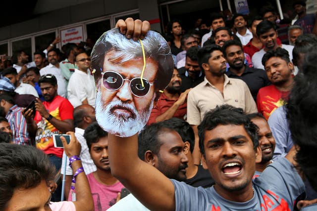 Rajinikanth fans leave a cinema in Chennai, India, after watching the actor’s new movie ‘Kabali’