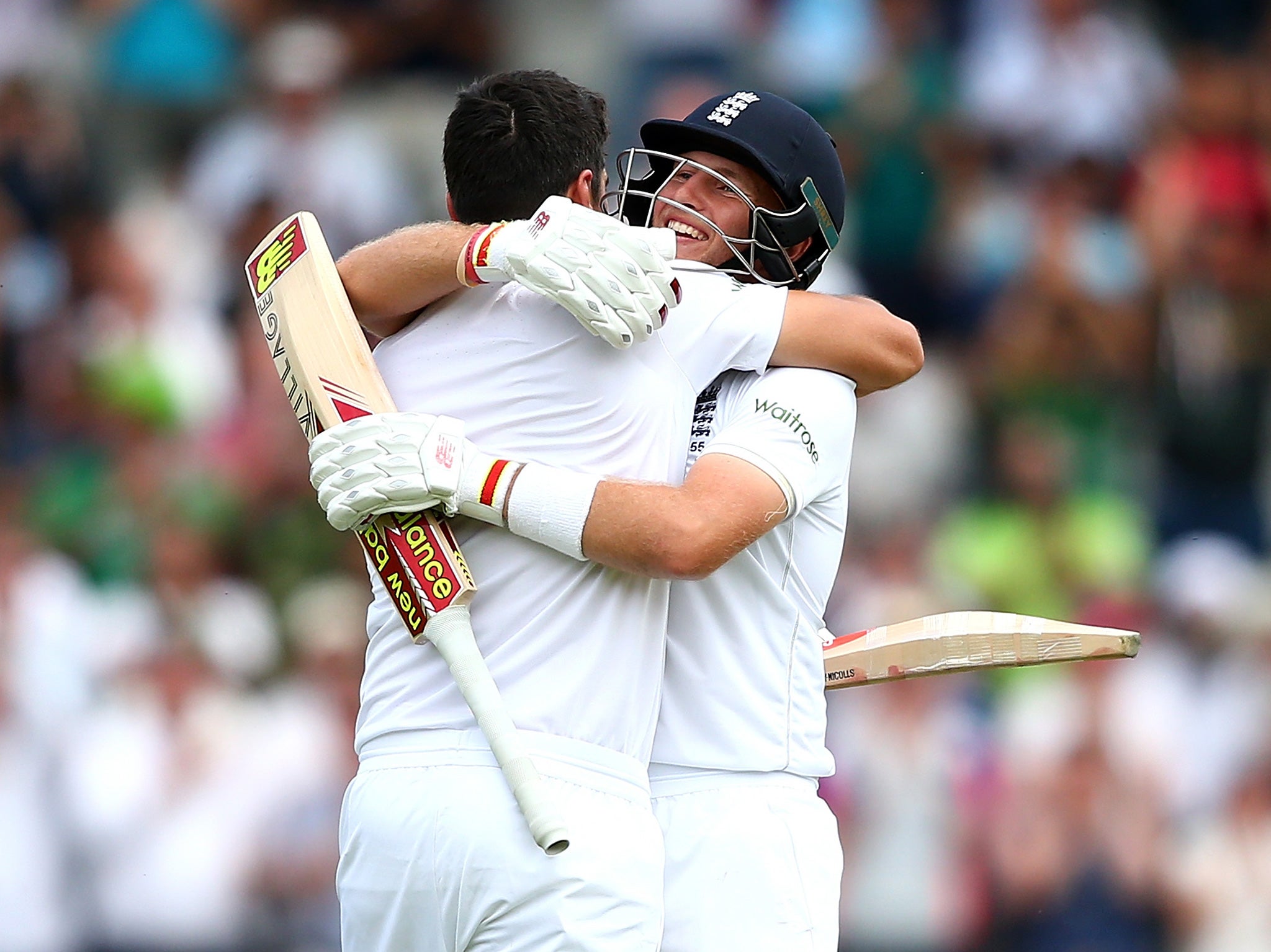 Cook and Root celebrate the former's century on the first day of the second Test