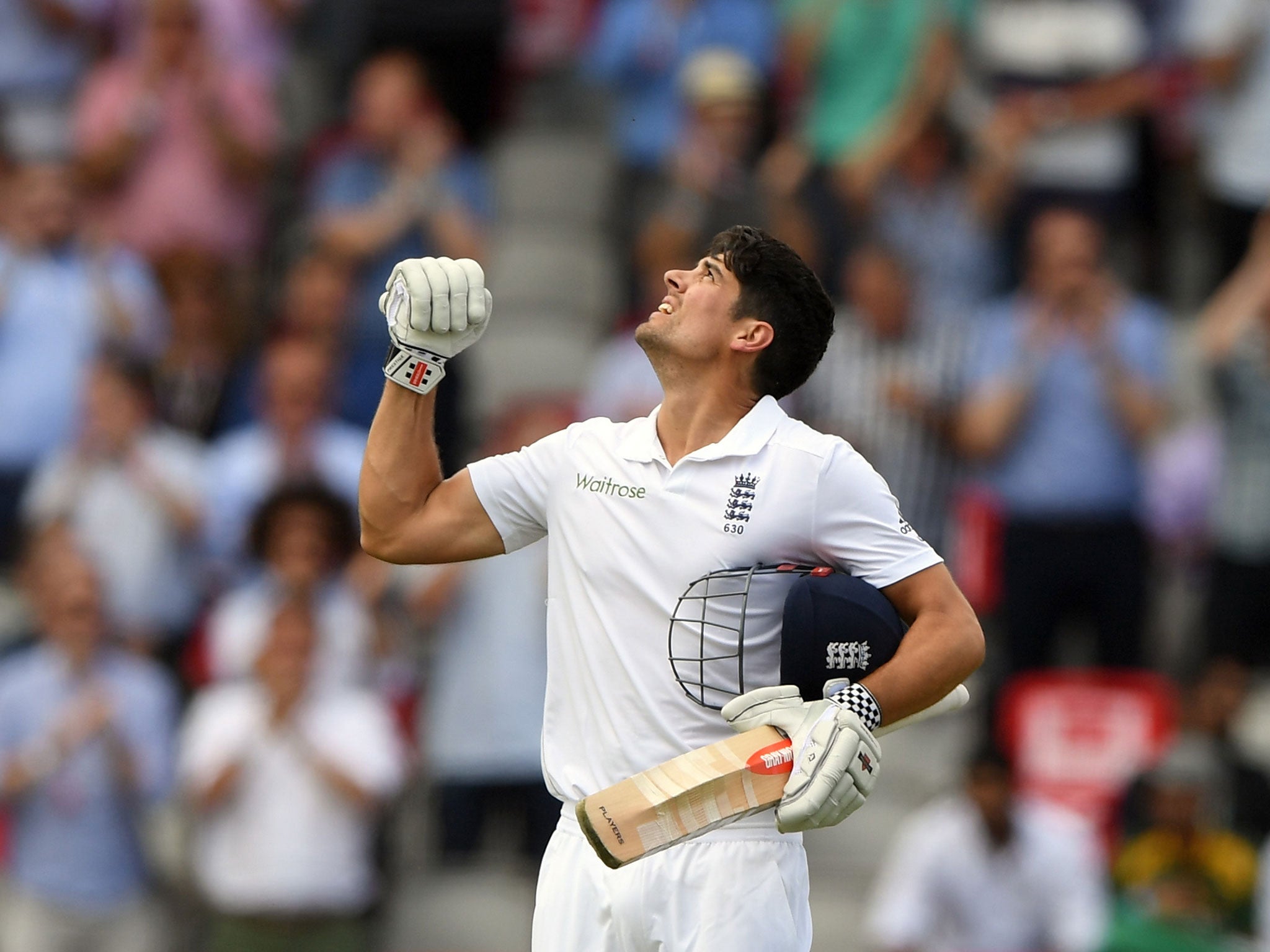 Alastair Cook celebrates reaching his hundred at Old Trafford
