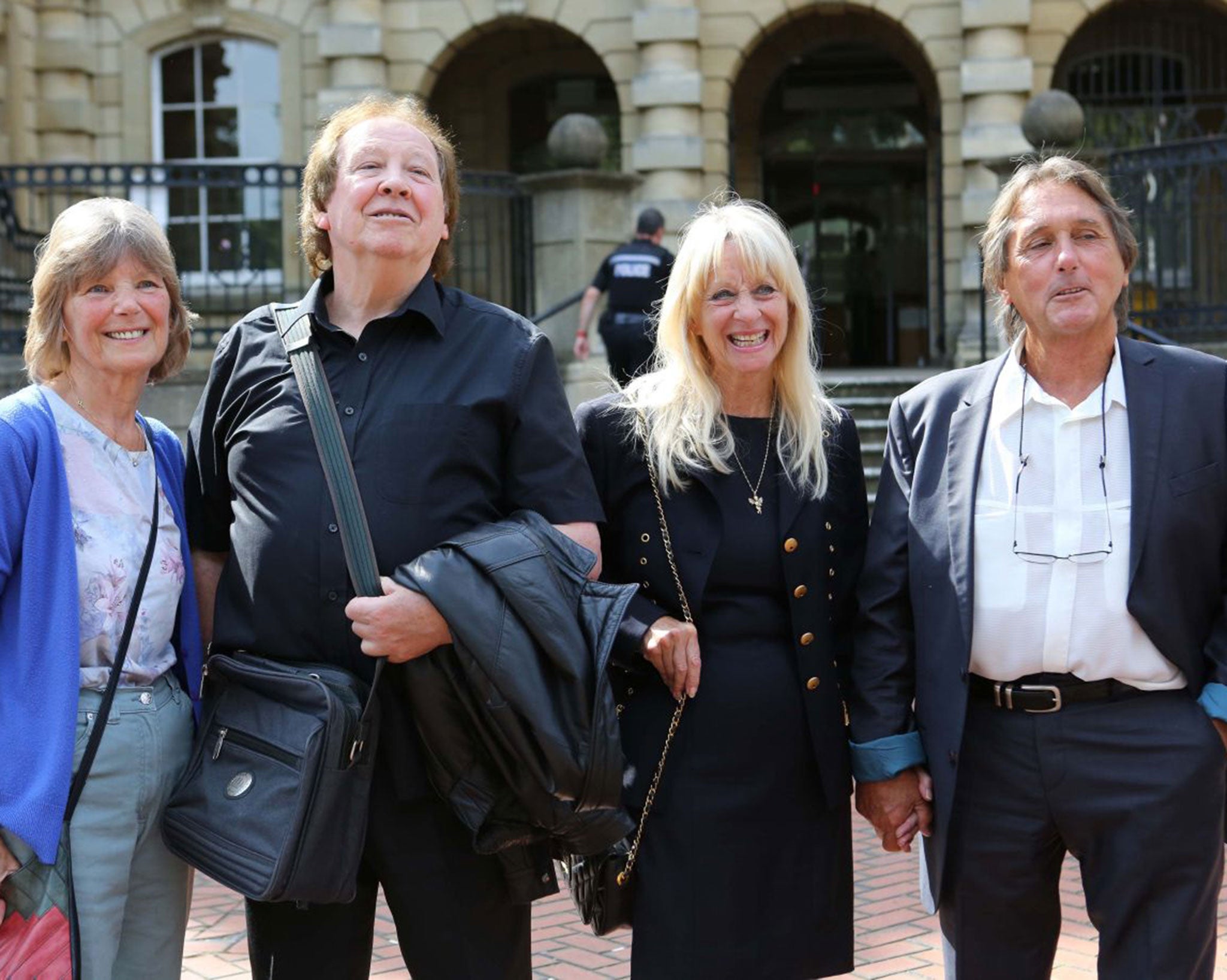 Richard Westwood (second left) and Leonard 'Chip' Hawkes, with their wives, outside Reading Crown Court after their acquittal