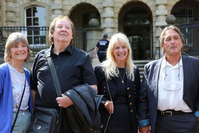 Richard Westwood (second left)  and Leonard 'Chip' Hawkes, with their wives, outside Reading Crown Court after their acquittal