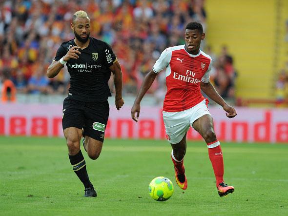 Jeff Reine-Adelaide takes on Lens midfielder John Bostock (Getty)