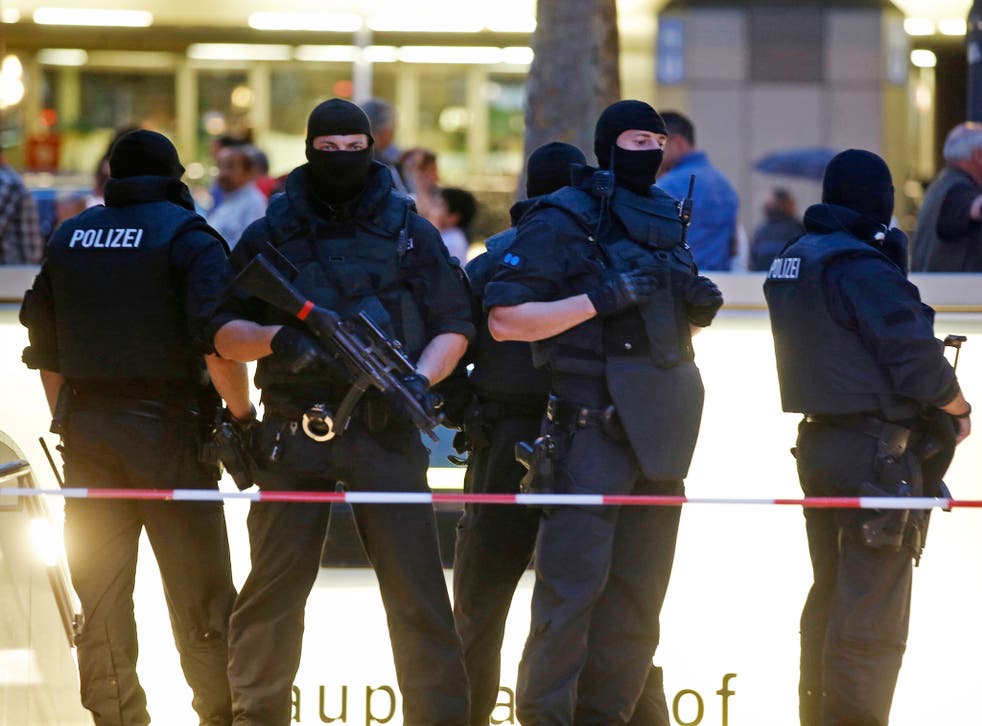 Special forces police officers stand guard outside Munich's main train station