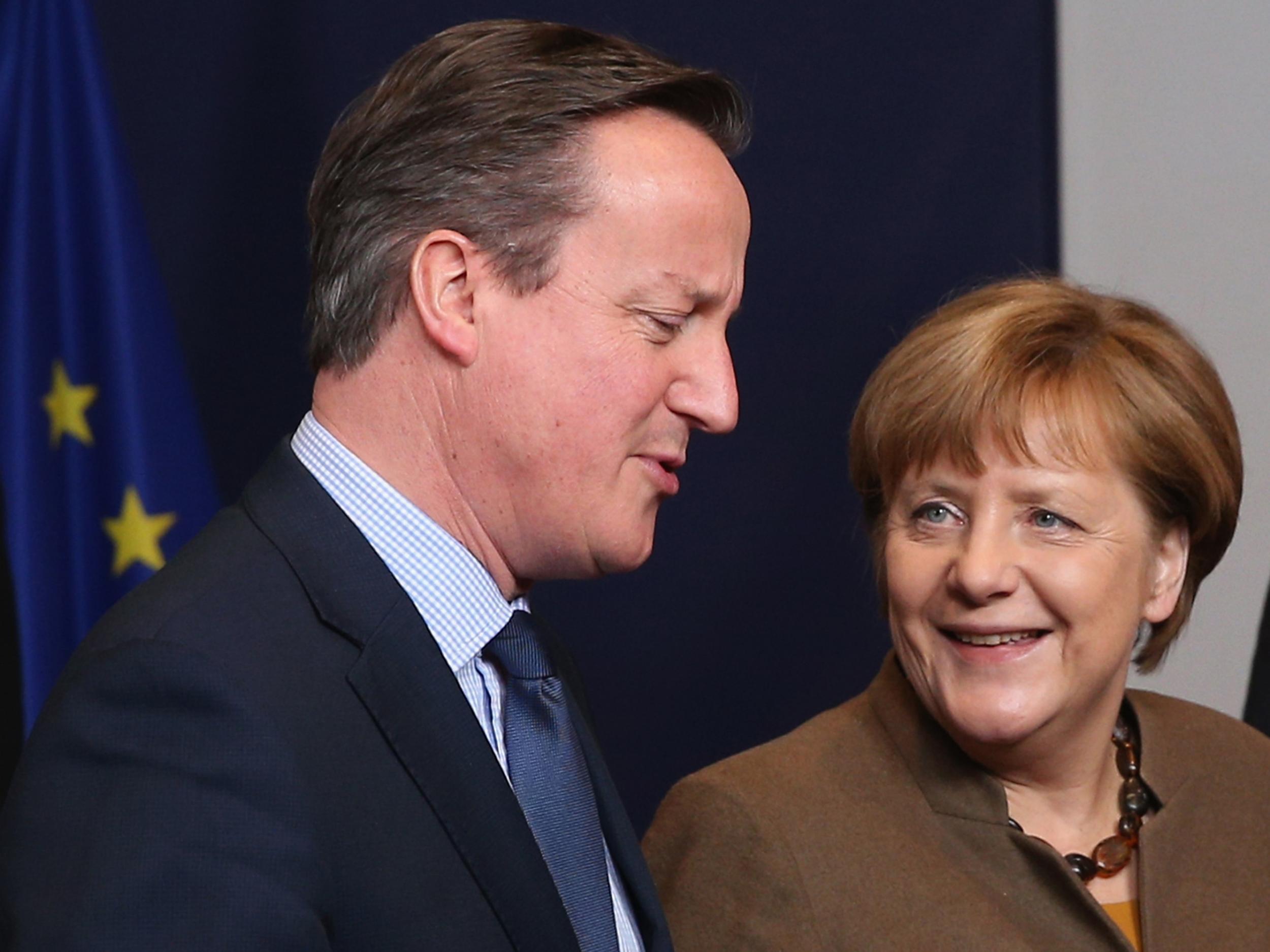 Mr Cameron with German Chancellor Angela Merkel