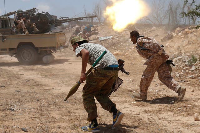 Libyan forces allied with the UN-backed government fire weapons during a battle with Isis fighters in Sirte, Libya, on 21 July