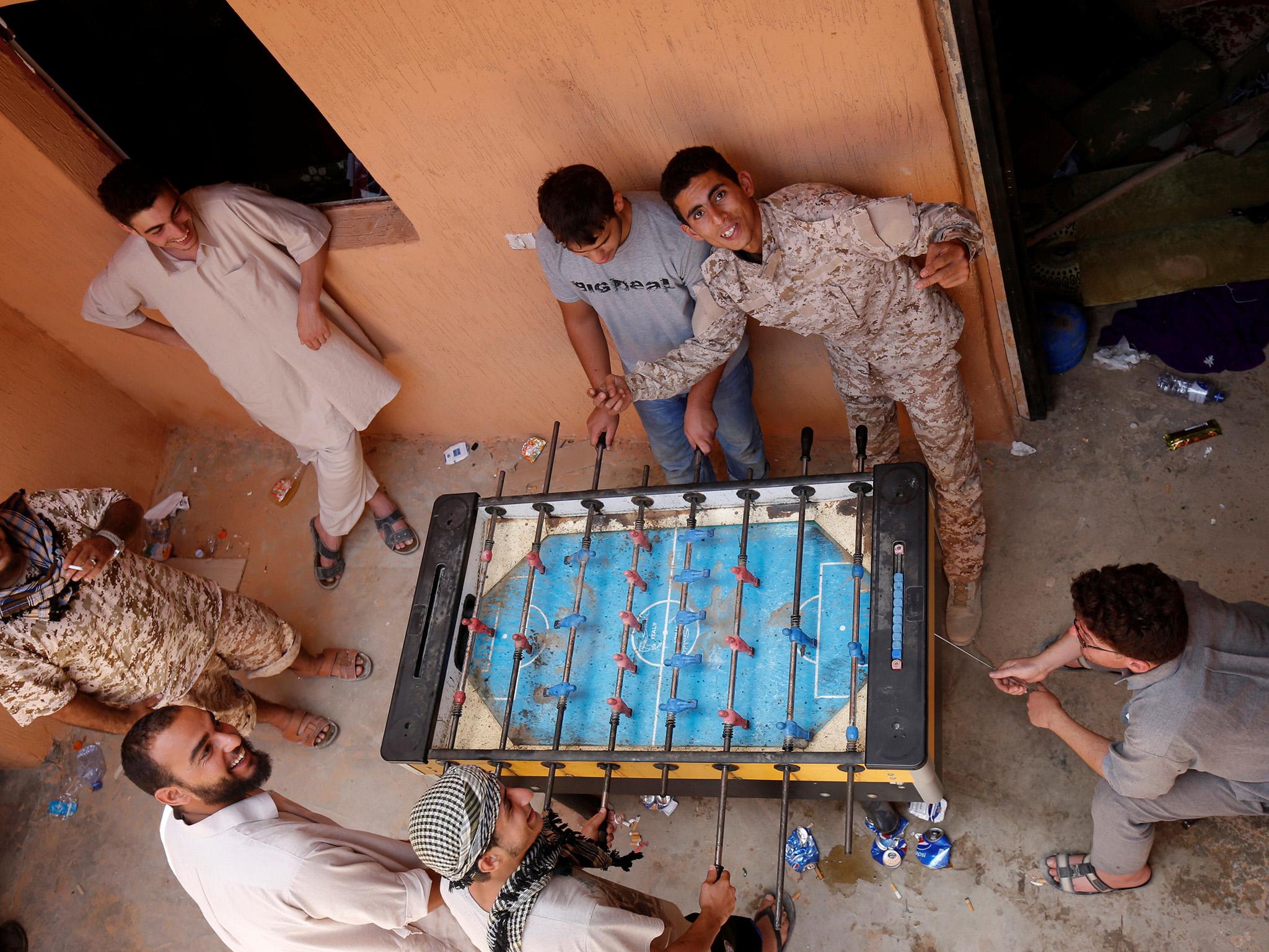 Some of the Libyan forces getting in a game of table football