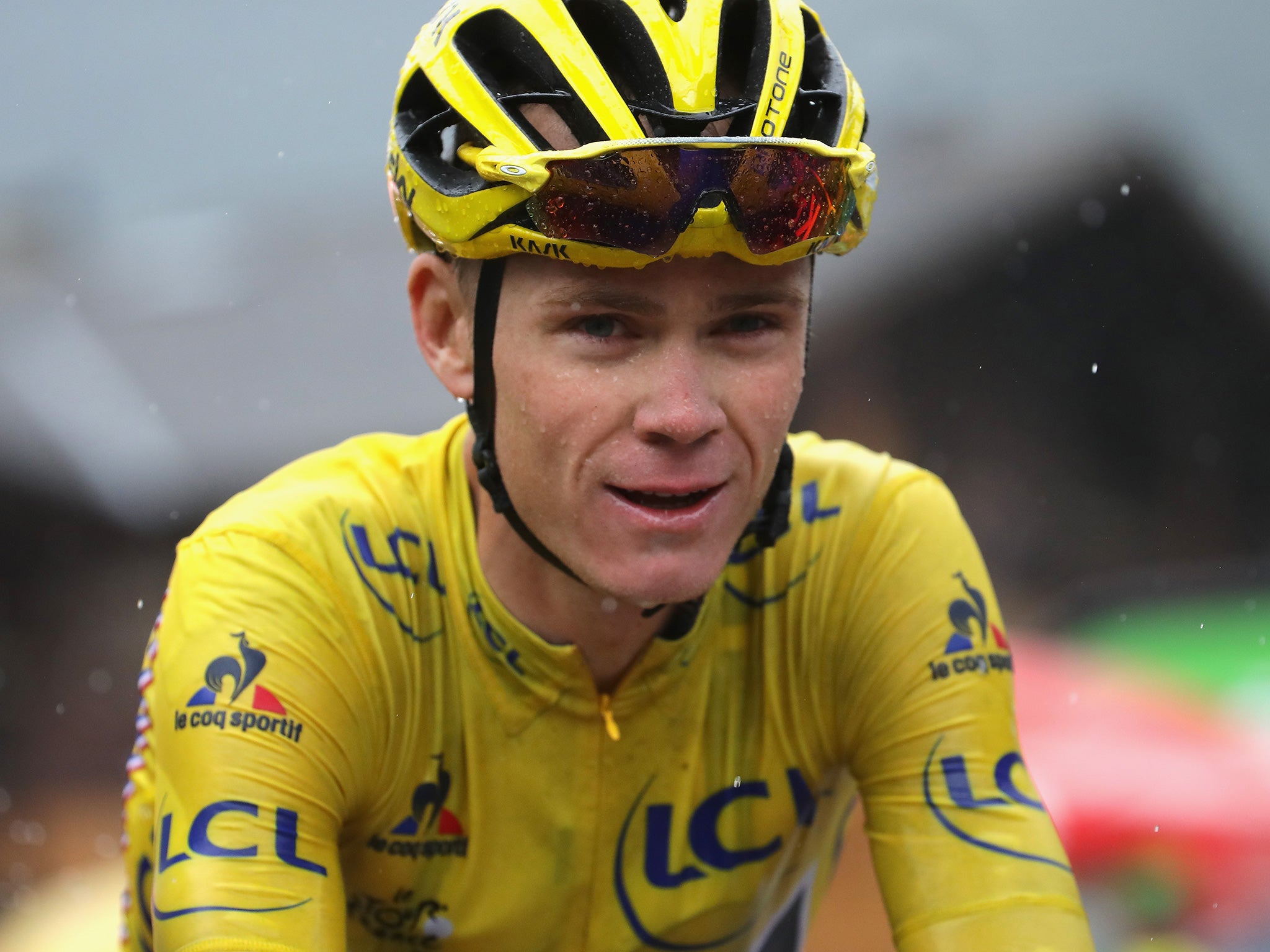 Froome negotiated a slippery descent and crossed the line unscathed