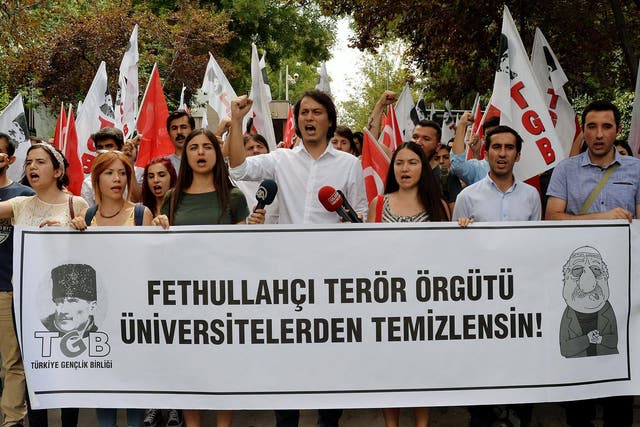 Pro-nationalist university students hold a protest against US-based cleric Fethullah Gulen and his followers during a demonstration in Ankara after last year’s abortive coup