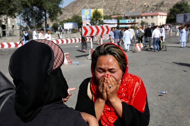 An Afghan woman weeps at the site of a suicide attack in Kabul