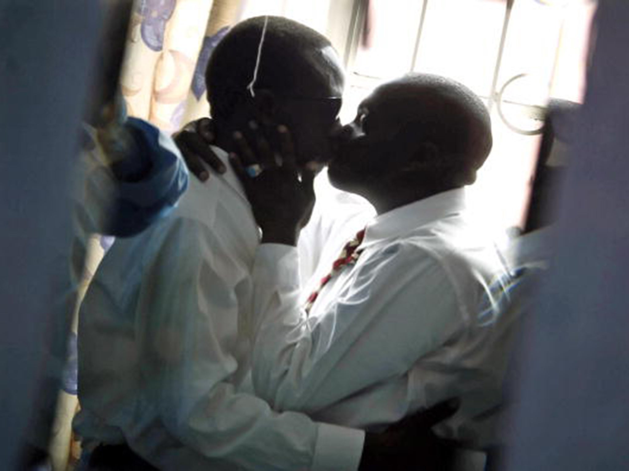Two men kiss in Kenya, another country in east Africa where homosexuality is illegal