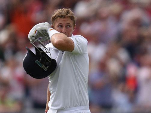Joe Root prepares to depart the field after being dismissed for 254 at Old Trafford (Getty)