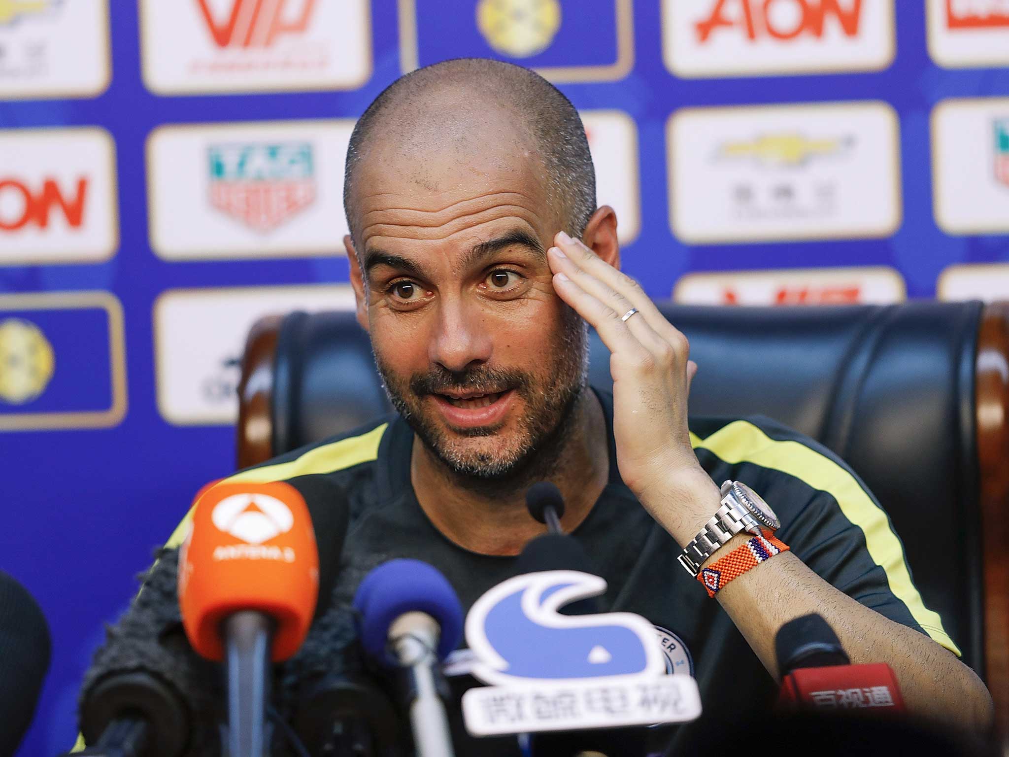 Pep Guardiola talks to the media in Asia on Manchester City's tour of the region