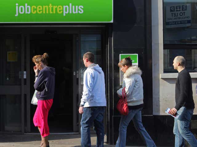 People queue outside a job centre in Bristol, UK