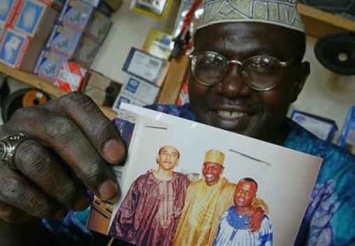 Malik Obama holds a photograph showing him and his brother