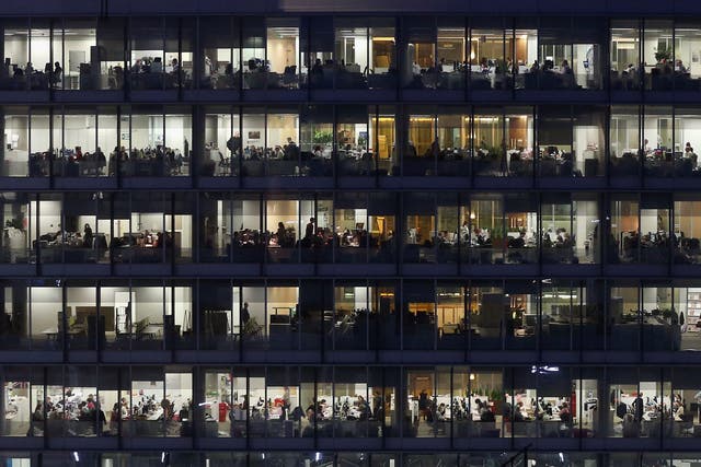 Office workers work into the night at their offices in Southwark, London