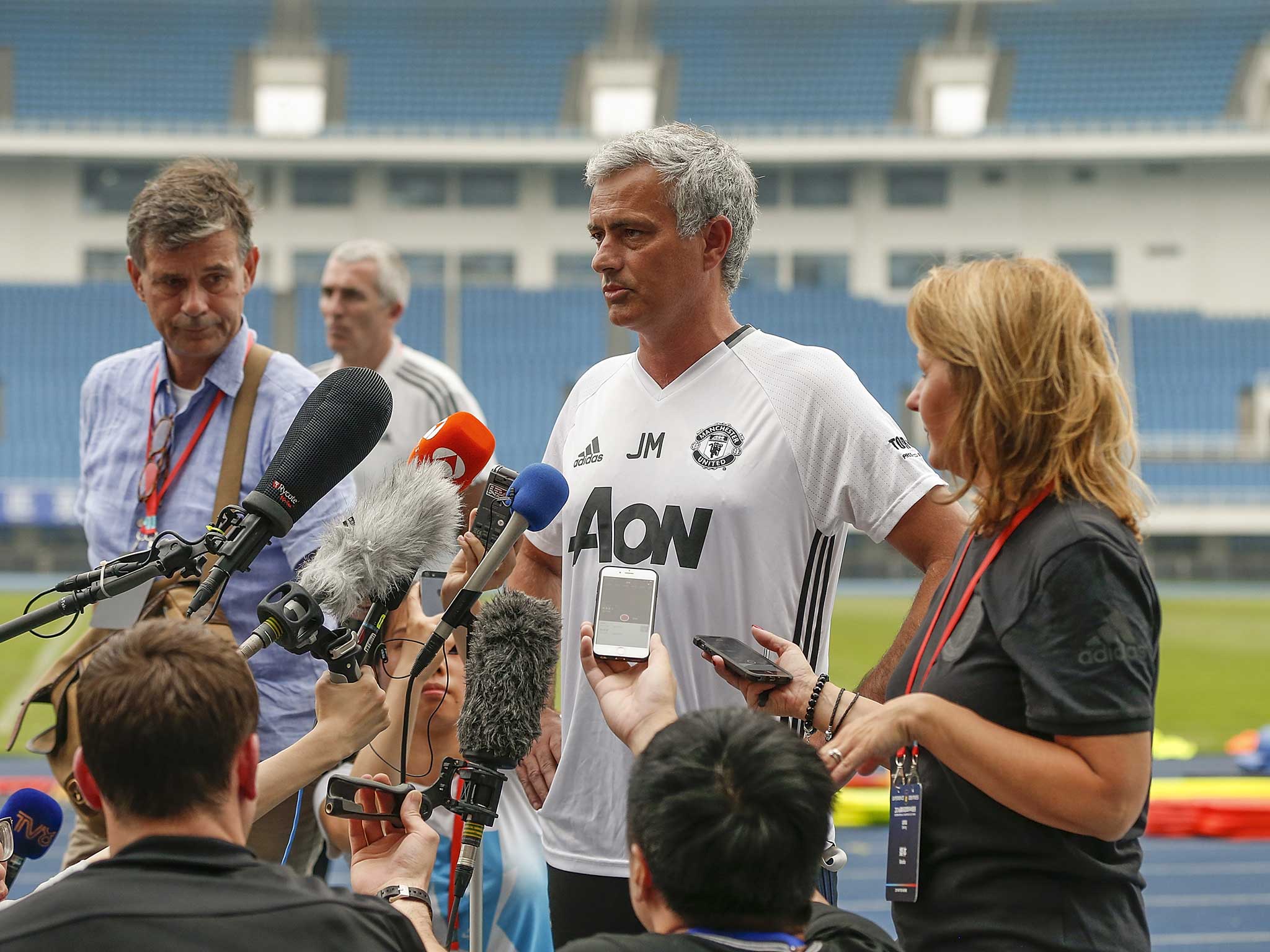 Jose Mourinho speaks to the media outdoors in bizarre scenes in China