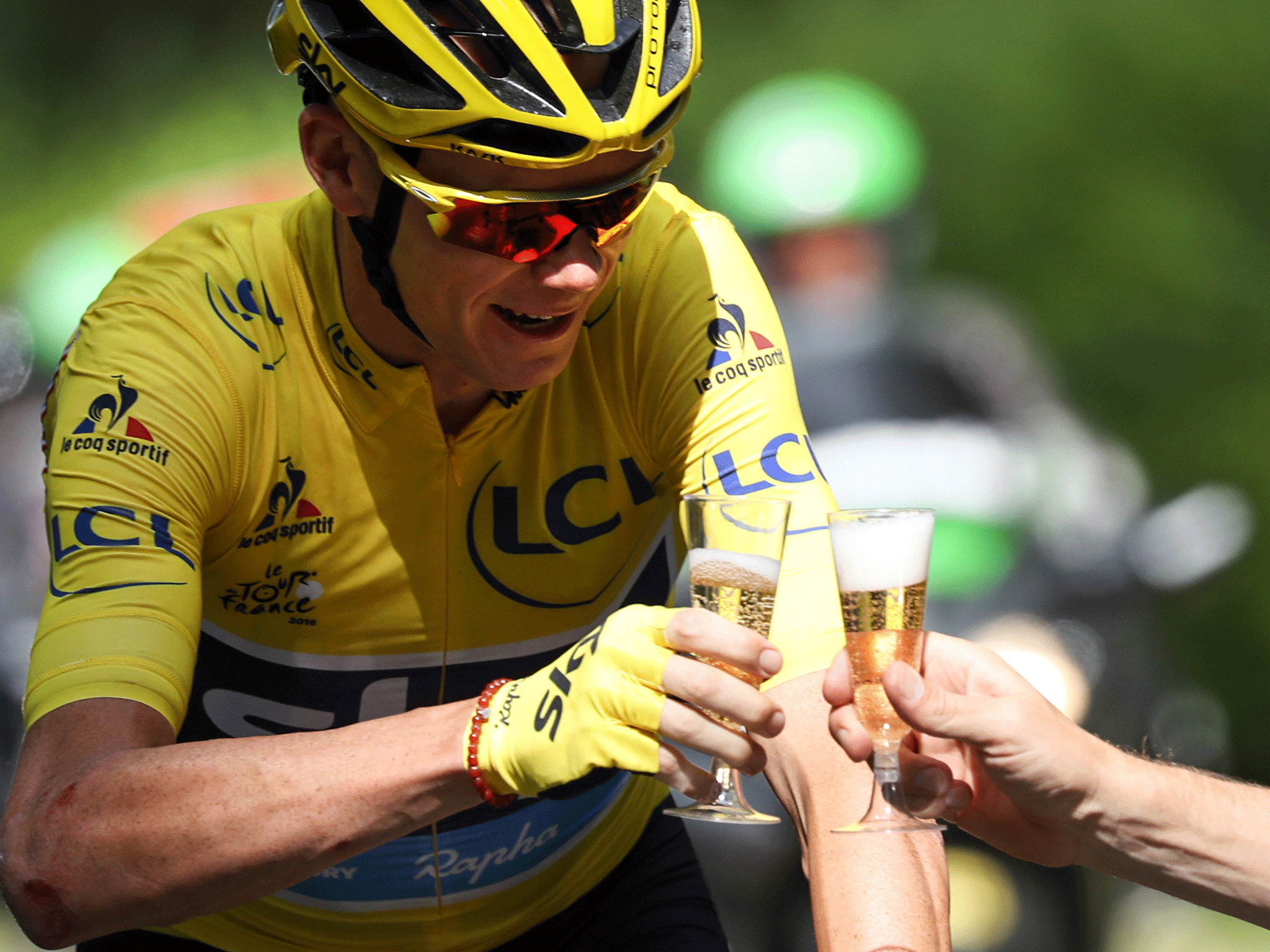 Chris Froome celebrates on the road during Sunday's final stage