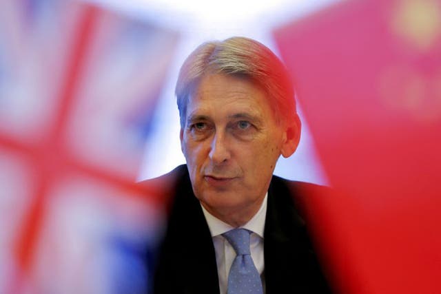 Philip Hammond attends a meeting last week at the Bank of China head office building in Beijing